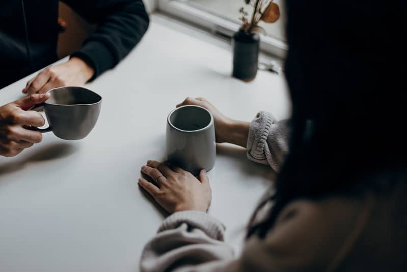 Two people having a cup of coffee