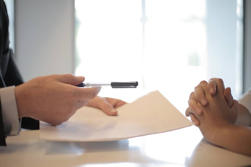 Two people perusing a contract