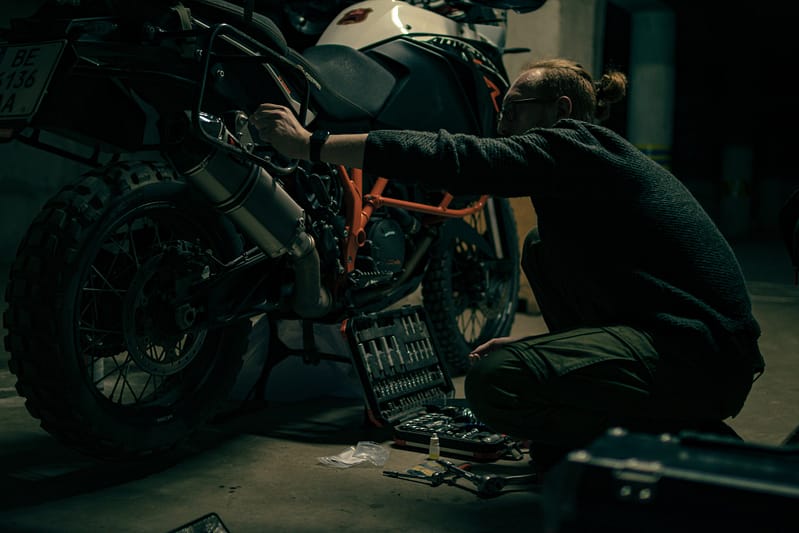 Someone inspecting their motorbike