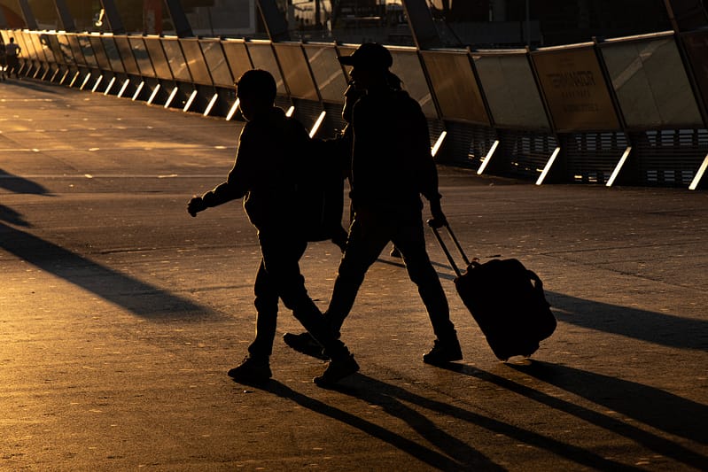 two people crossing the road