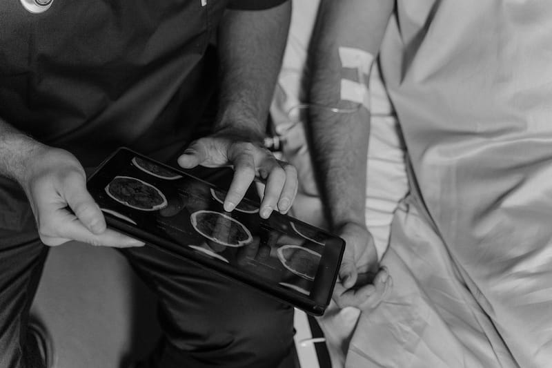 A doctor looking at brain scans