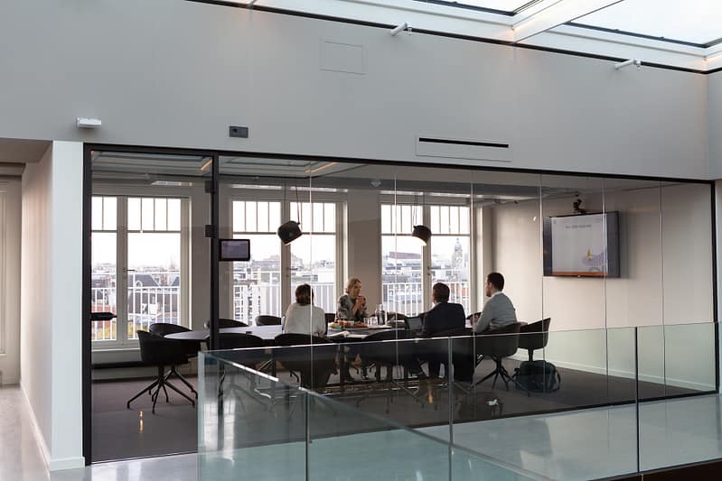 people sat in a meeting room