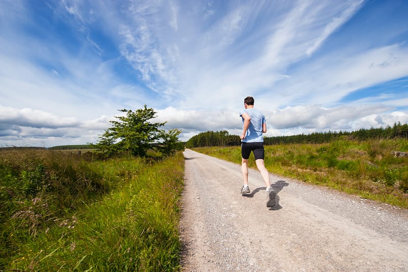 someone running in the countryside