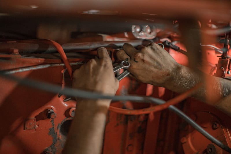 A mechanic fixing a car