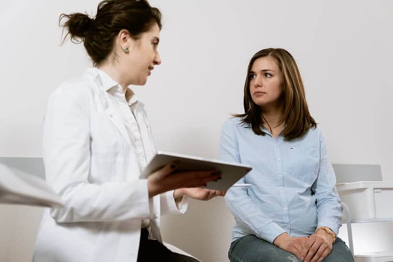 A doctor talking to a patient