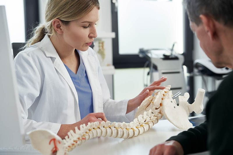 doctor talking with patient about spinal cord injury