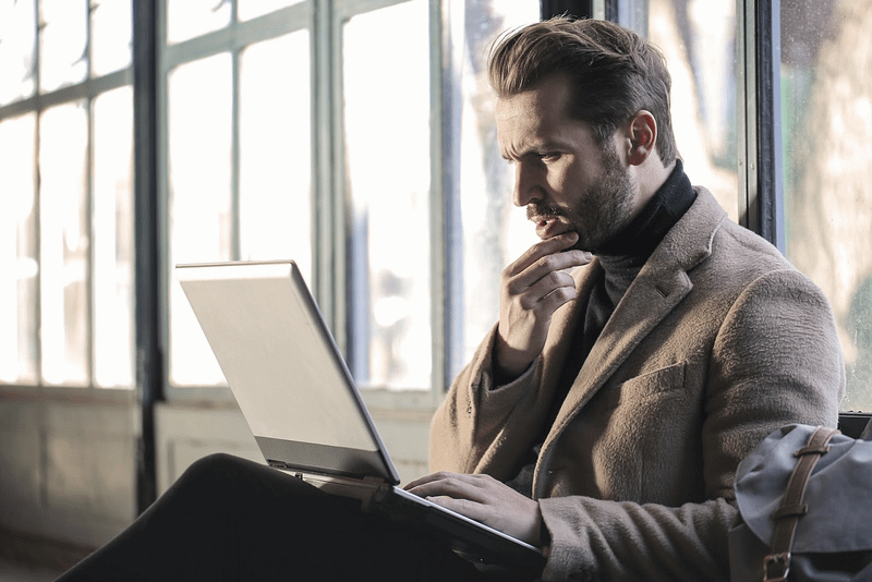 Man researching on his laptop