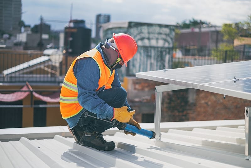 Maintenance man during his shift on a roof