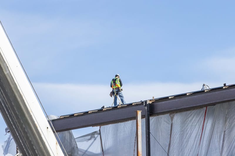 A roofer working on a roof