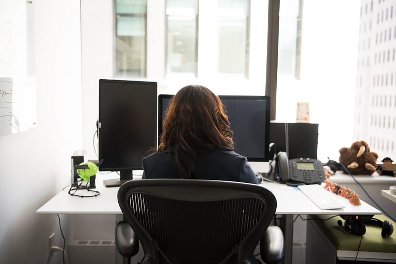 someone sitting at their desk