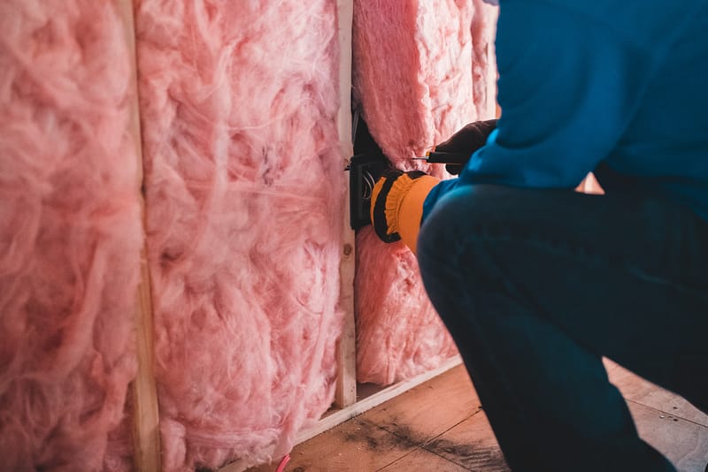 someone installing insulation