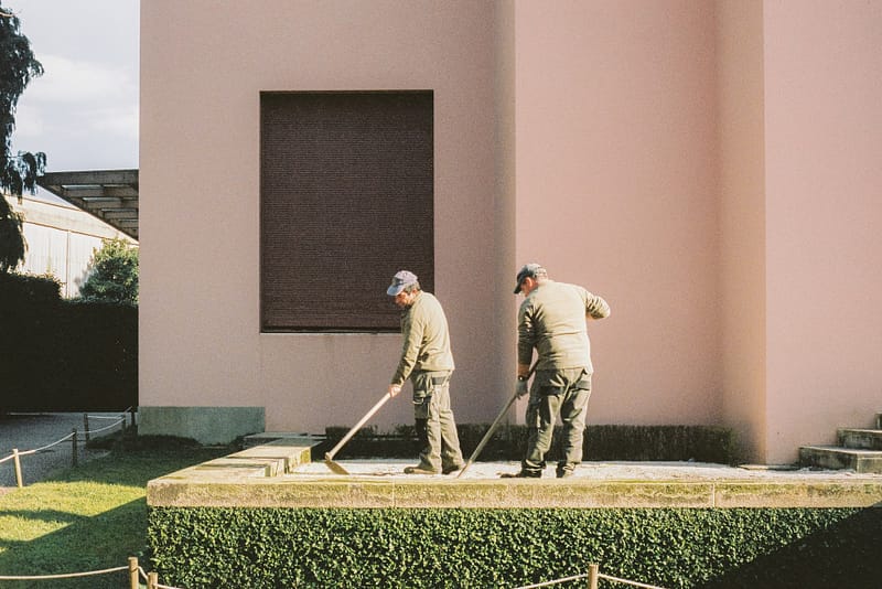 two gardeners working in the heat