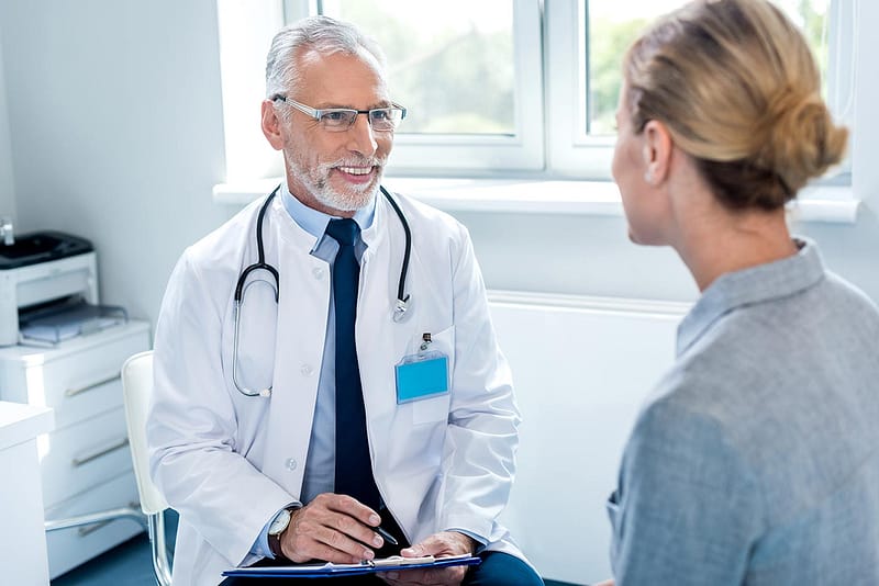 smiling doctor with patient