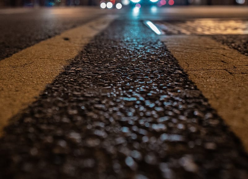 A close up shot of a pedestrian crossing at night