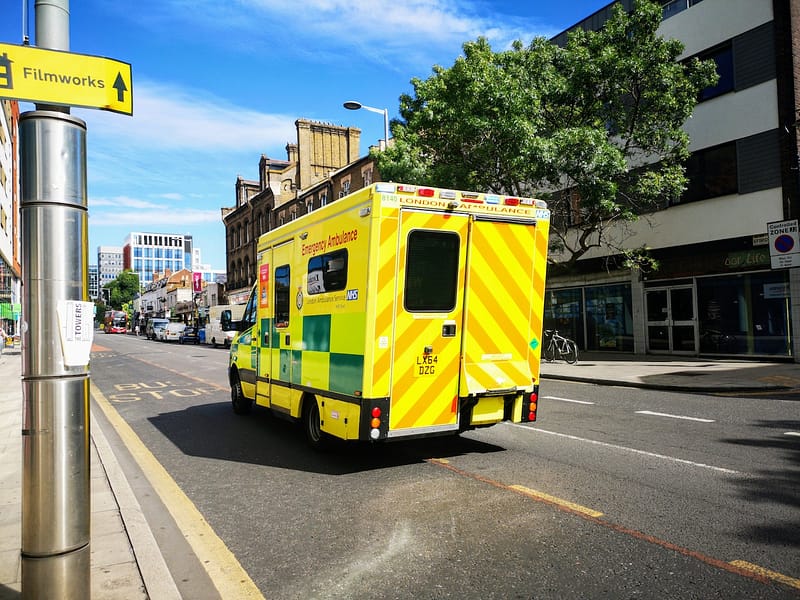 the back of an ambulance driving down a street