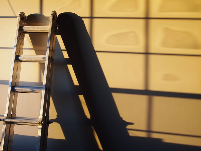 A ladder resting on a wall