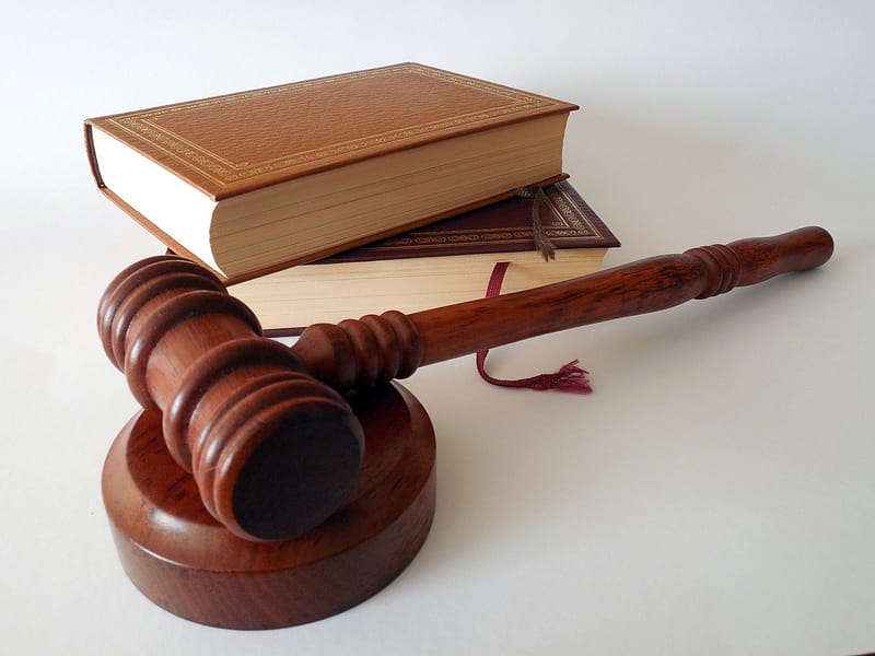 A gavel with law books