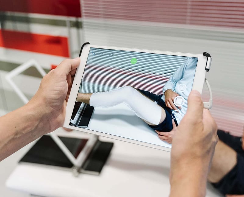 A doctor using an ipad