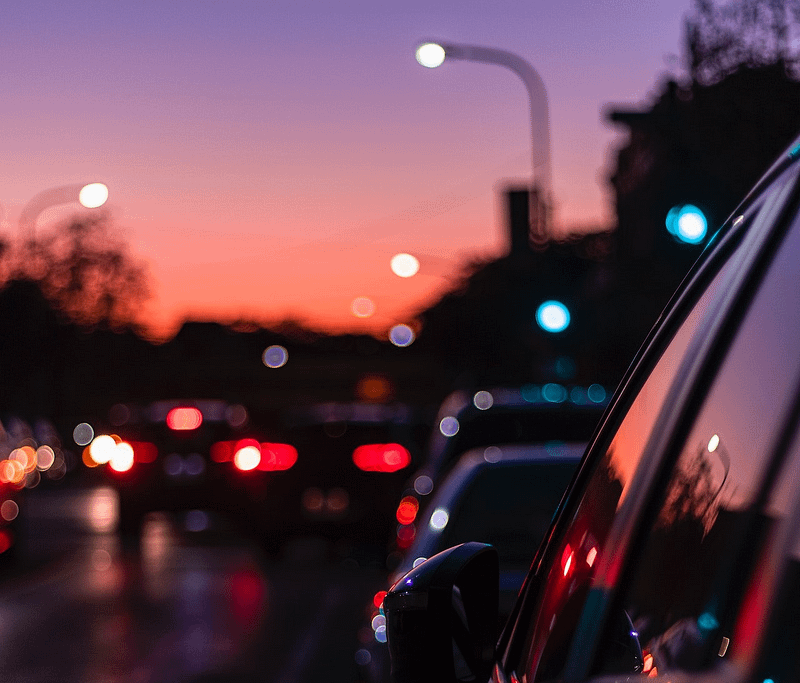 A sunset on a busy road