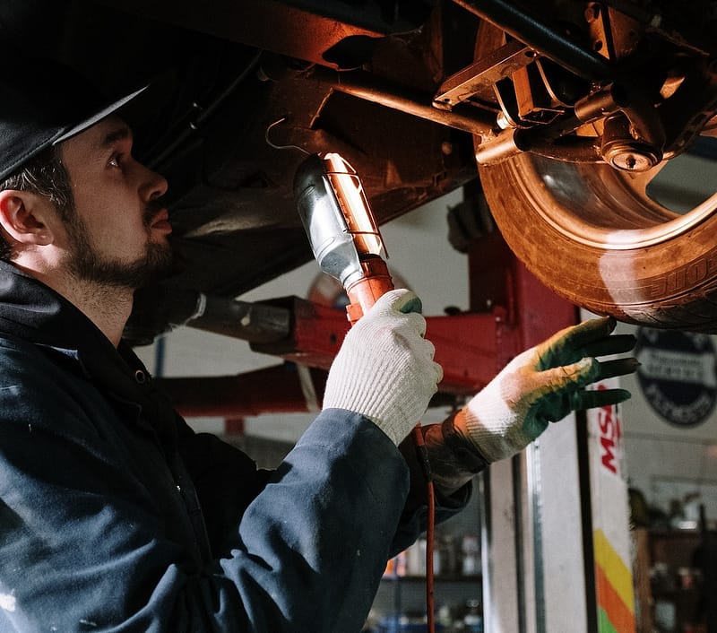 mechanic inspecting a car