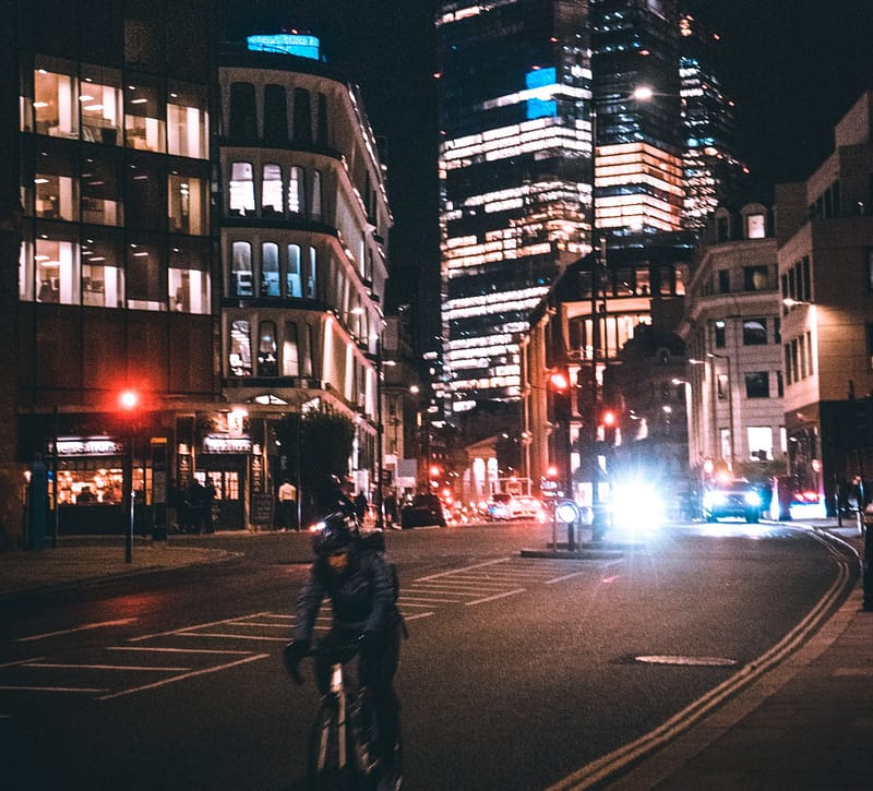 Cycling at night on a busy road