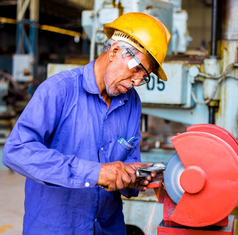 Older person using electric saw